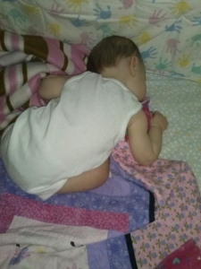 In case you can't tell.. she is sleeping on her legs. folded in half.